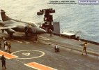 S.2A XV357 of 809 NAS onboard HMS Ark Royal in 1973; here being guided onto the Ark's waist catapult. Note the catapult bridle lying on the deck; these were lost in the sea for many years before somebody realised how easy it would be to save and re-use them, saving a fair bit of money in the process.