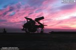 Dawn breaks over HMS Ark Royal and one of her Gannets awaits the day's action.