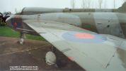 T.5 XS417. More of the port fuselage side and spine. Also good view over the port wing's upper surface - note straight leading edge. The port aileron is slightly deflected; note how the wing tip is part of the aileron and goes up in opposition along with the arm further inboard. The navigation light on the straight wing variants is inboard; on the kinked wing variants it is on the corner and curves out to form a teardrop shape.