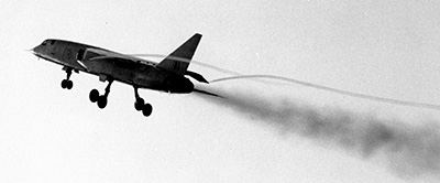 XR219 climbing showing engine smoke