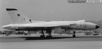 The elephant badge on the tailfin identifies this Vulcan B.2, XM570, as belonging to 27 Squadron based at RAF Scampton. It is seen taxiing past the RAF Khormaksar Hunter Wing pan at the beginning of a short visit to the Middle East in 1964.